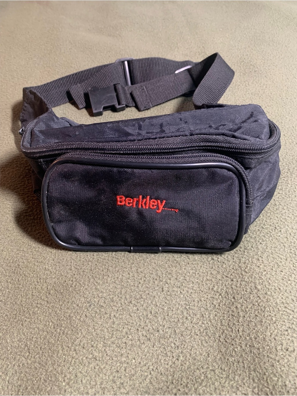 FUC Berkley black nylon fanny pack with adjustable straps.